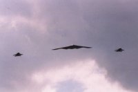 B2 Bomber escorted by 2 F-16s